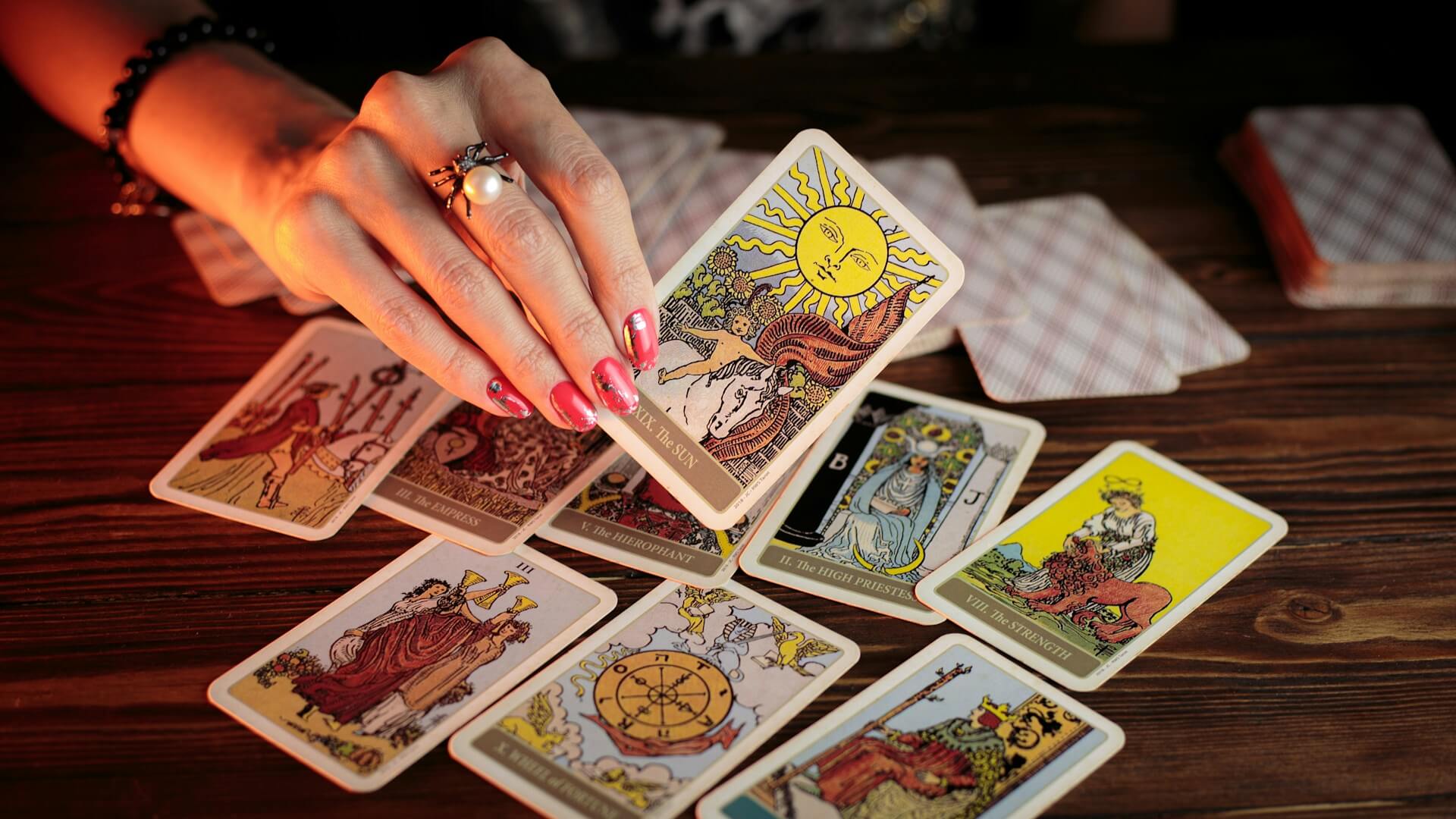Woman holding tarot cards